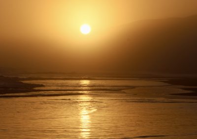 Sonnenuntergang über südafrikanischer Küste – Naturerlebnis mit Reload Südafrika Reisen